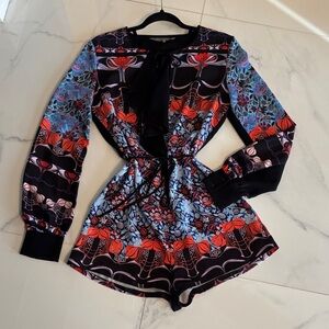 Clover Canyon Black Floral Tie-Neck Romper with Red & Blue Accents